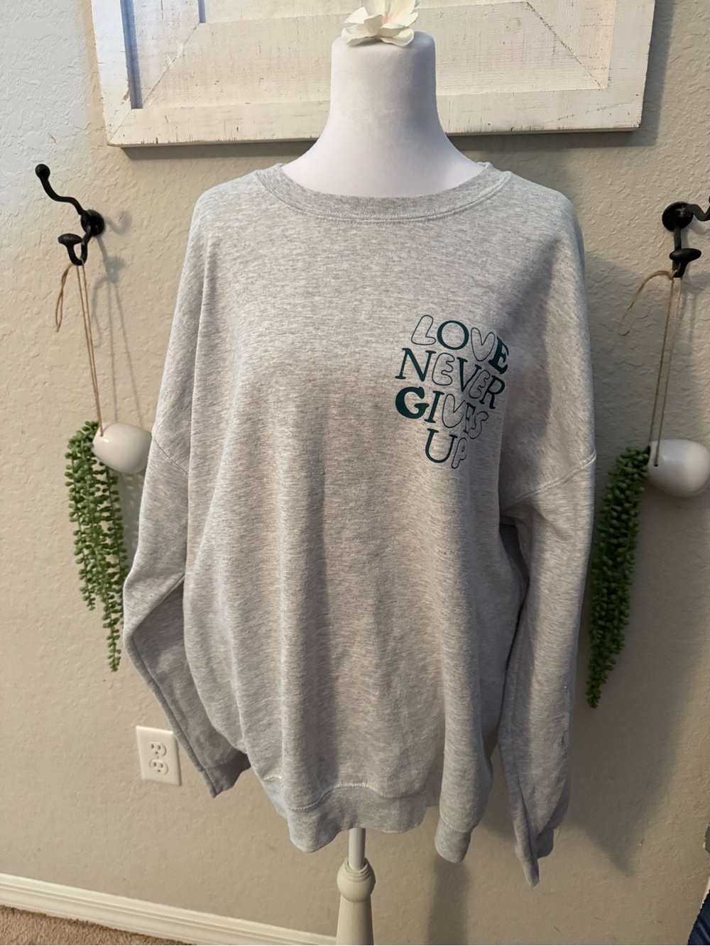 Grey 'Love Never Gives Up' Crewneck Sweatshirt